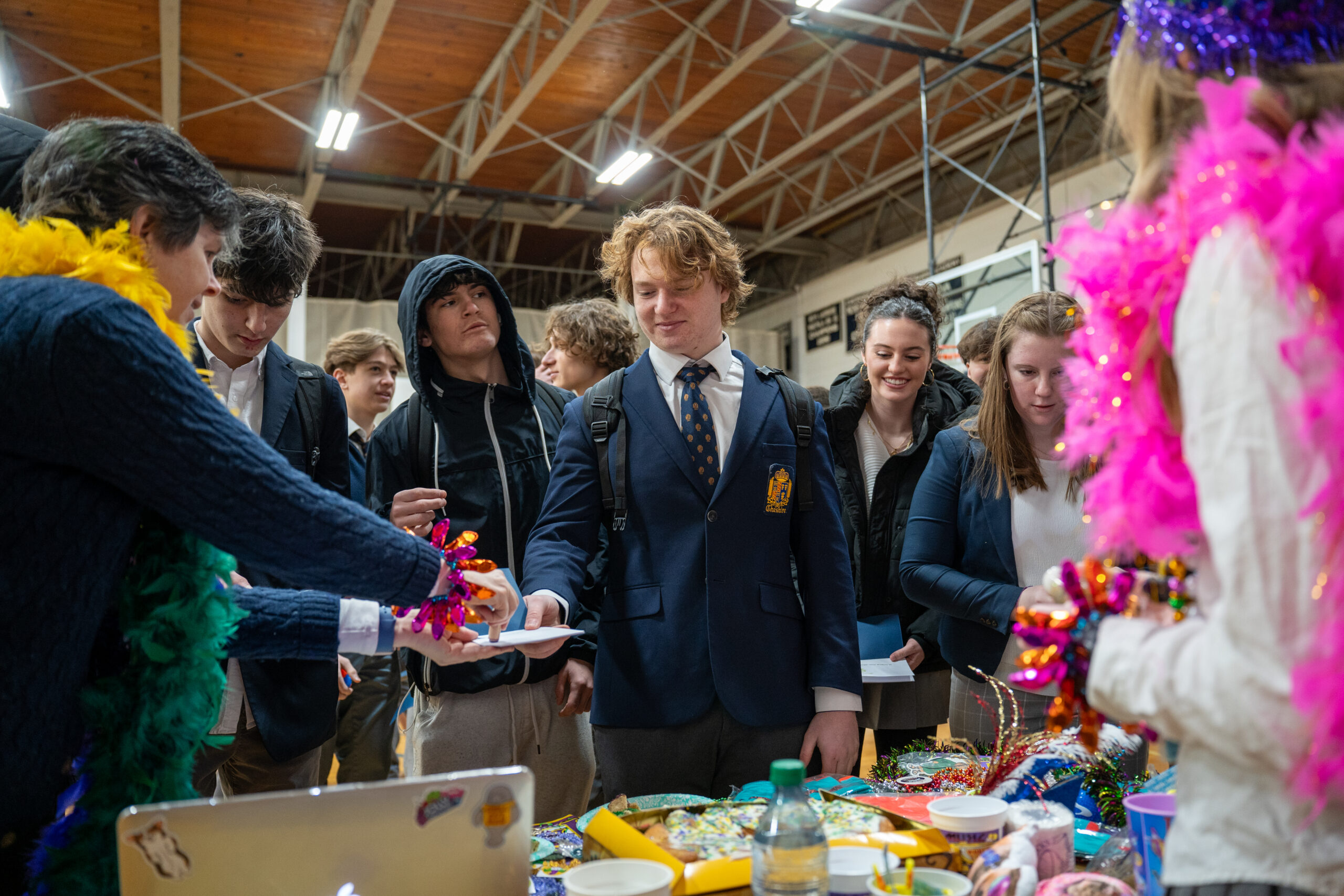 Cheshire Academy students standing around table with cultural items
